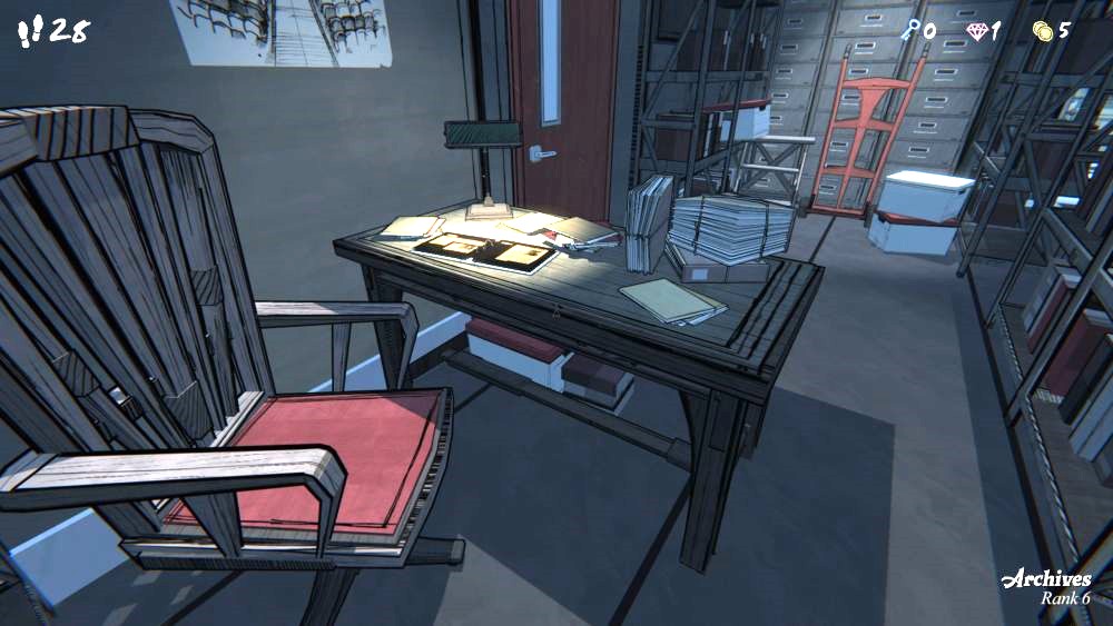 A desk in the archives room, with folders and a scrapbook arranged under a desk lamp.